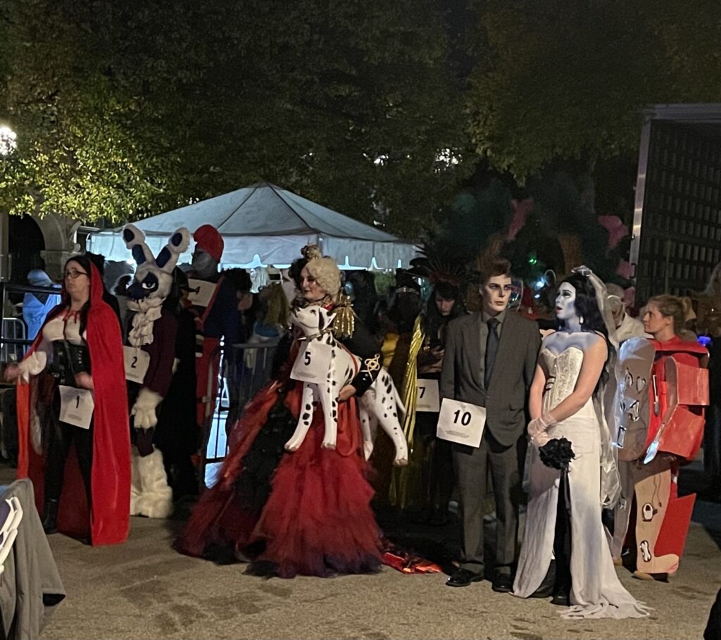 Costumed Halloween party guests participating in a themed event